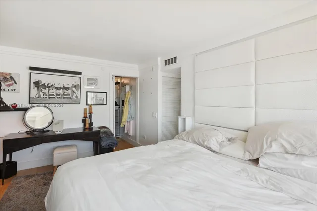 a kitchen with granite countertop a sink a stove and cabinets