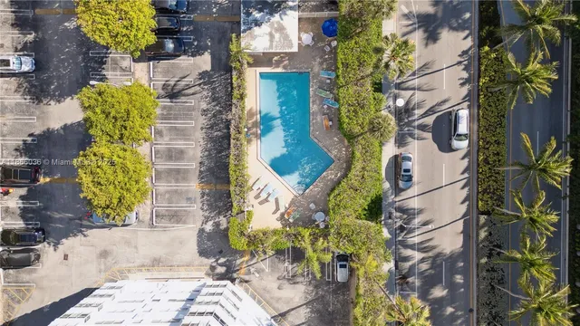 a vase of flowers sitting on a floor