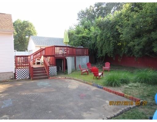 140 Nagle Street Springfield, MA 01151 - Photo 17 of 22 a view of a house with a yard and a garage