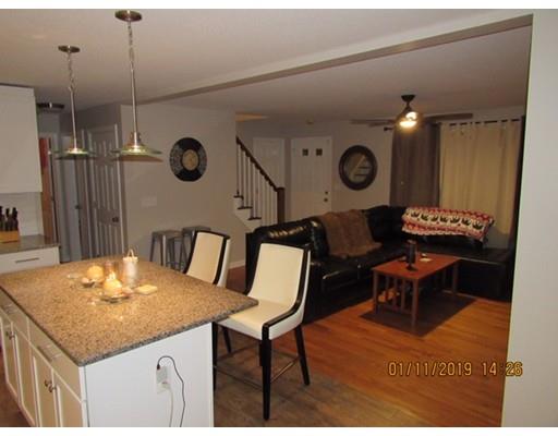 140 Nagle Street Springfield, MA 01151 - Photo 6 of 22 a kitchen with a table and a chair