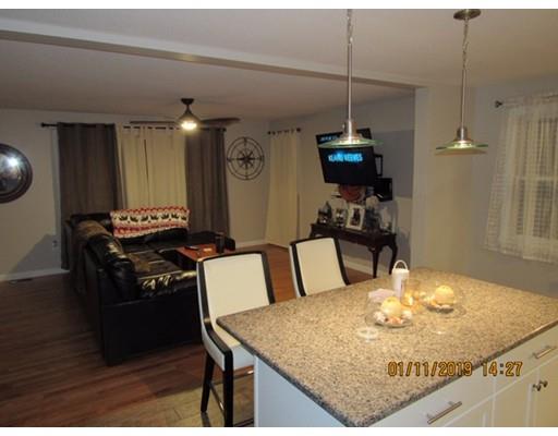140 Nagle Street Springfield, MA 01151 - Photo 7 of 22 a kitchen with a table and chairs