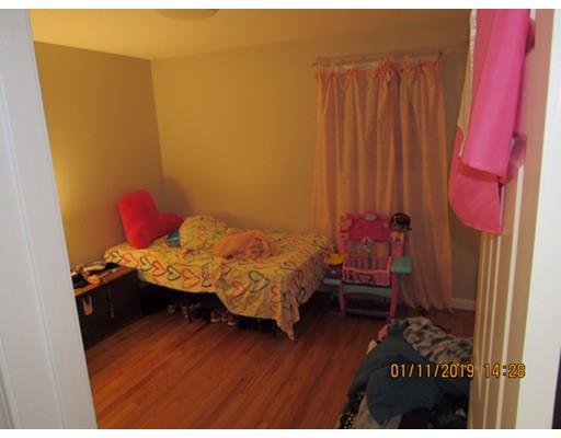 140 Nagle Street Springfield, MA 01151 - Photo 10 of 22 a bed room with a bed and a window