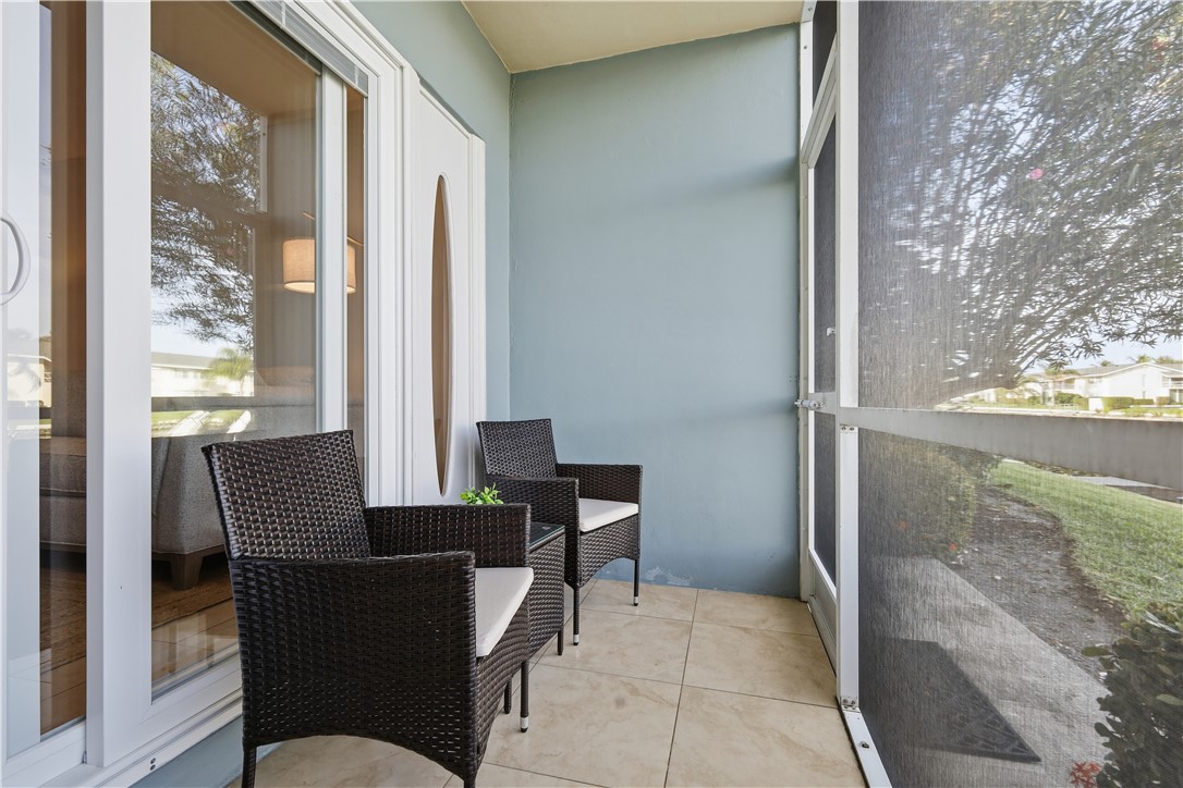 1830 Robalo Drive, Unit B102 Vero Beach, FL 32960 - Photo 17 of 33 a view of a dining room with furniture and a window