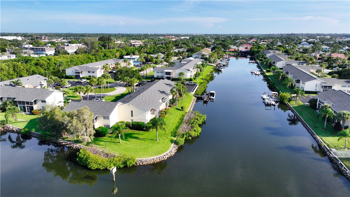 1830 Robalo Drive, Unit B102 Vero Beach, FL 32960 - Photo 21 of 33 an aerial view of a house with a lake view