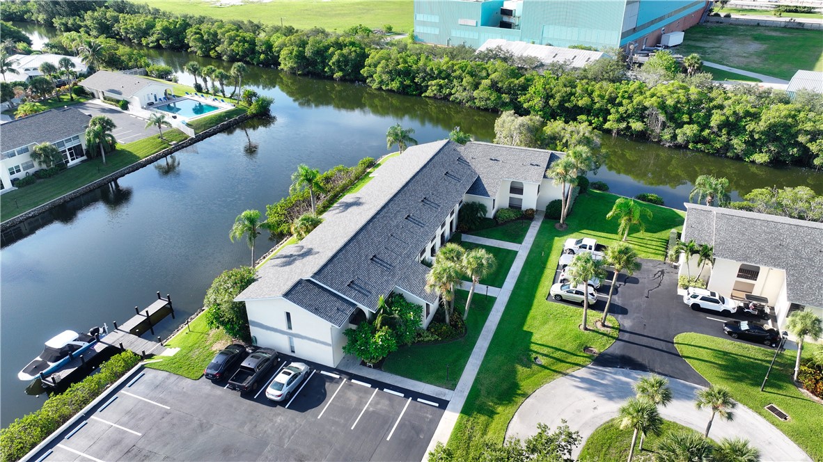 1830 Robalo Drive, Unit B102 Vero Beach, FL 32960 - Photo 28 of 33 an aerial view of a house with outdoor space and lake view