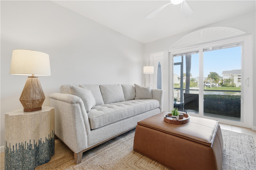 1830 Robalo Drive, Unit B102 Vero Beach, FL 32960 - Photo 3 of 33 a living room with furniture and window