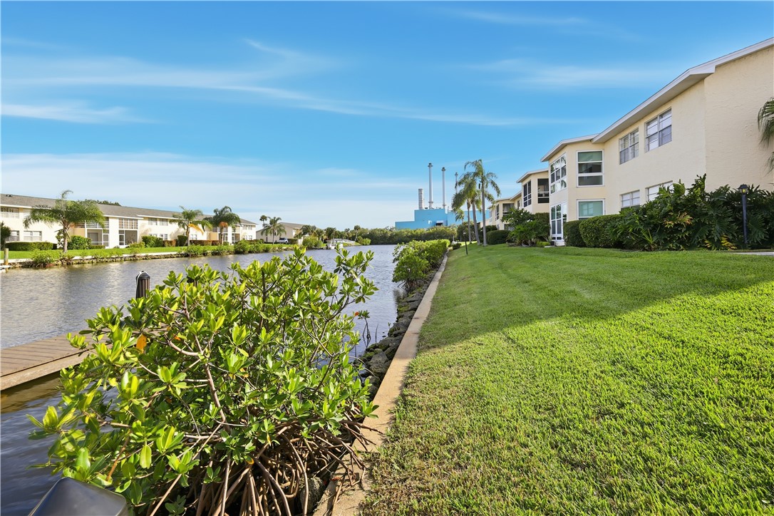 1830 Robalo Drive, Unit B102 Vero Beach, FL 32960 - Photo 32 of 33 a view of a yard with an ocean view