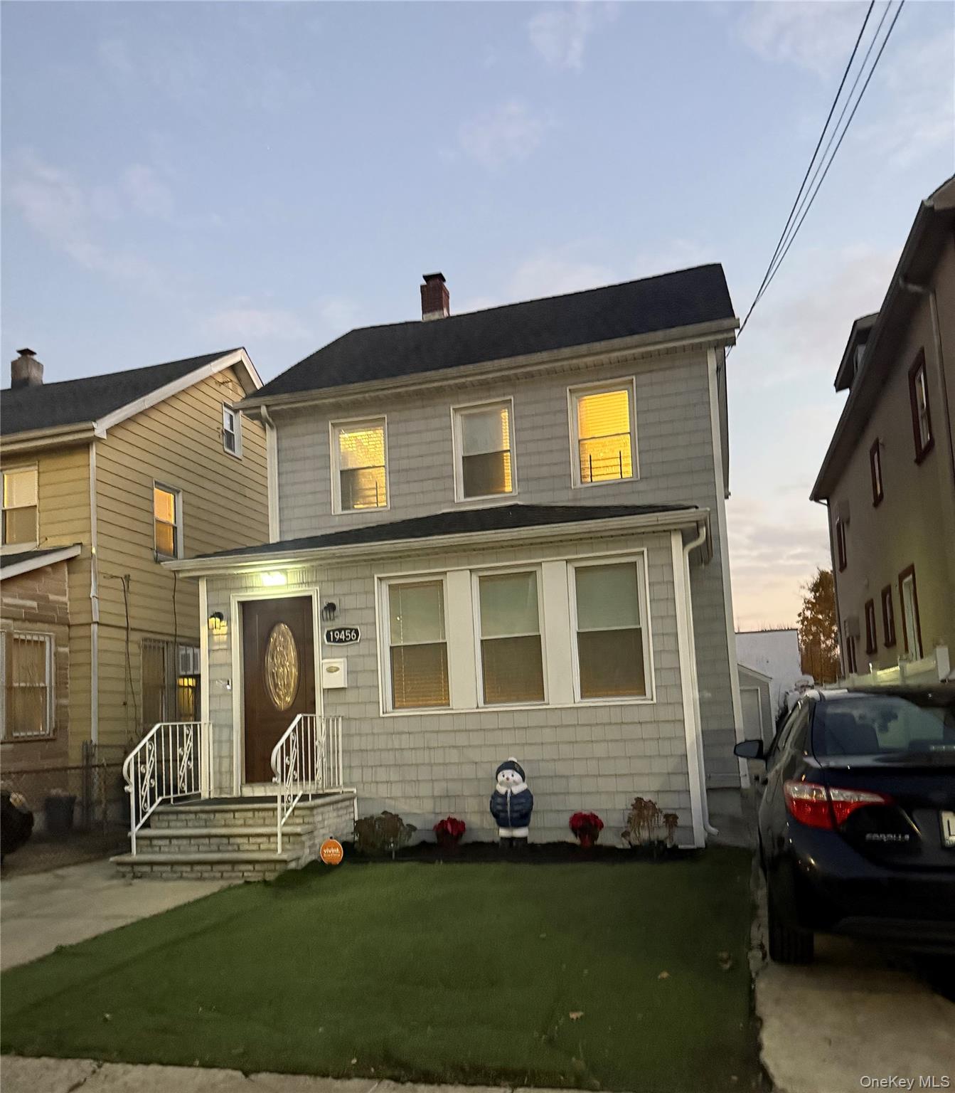 a front view of a house with a yard