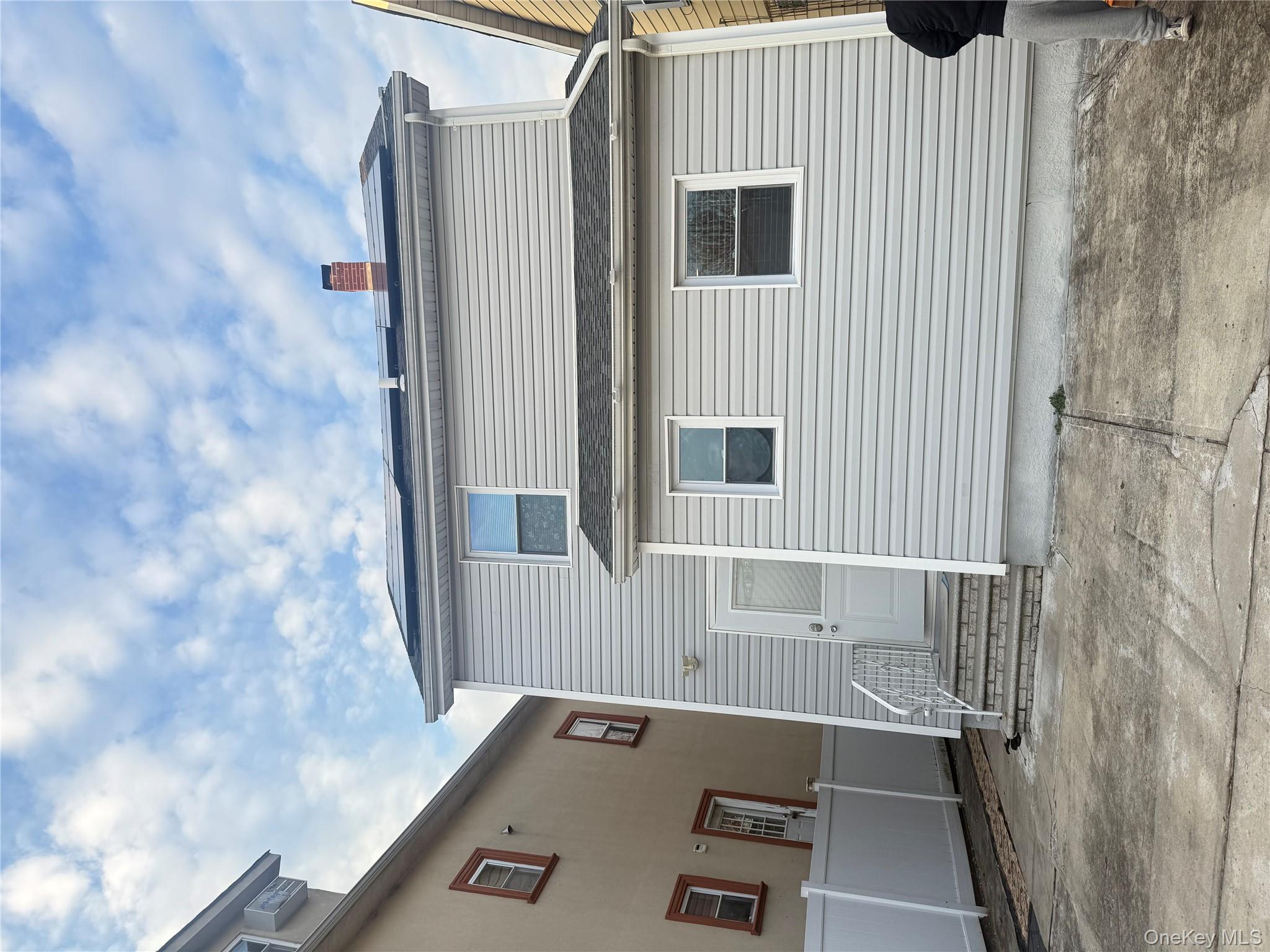 194-56 114th Road Queens, NY 11412 - Photo 2 of 16 a view of a house with garage