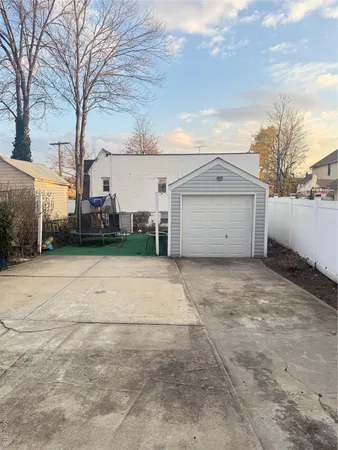 a view of garage yard and car parked