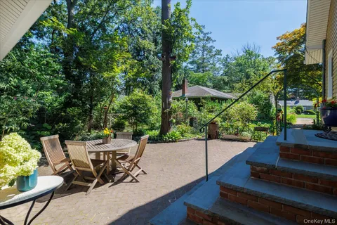 a patio with table and chairs