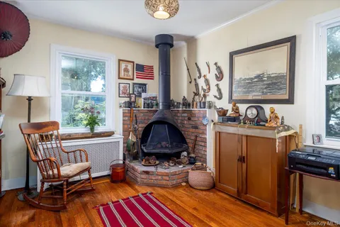 a living room with furniture a window and potted plants