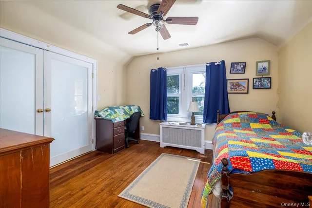 a kids bedroom with a bed and a window