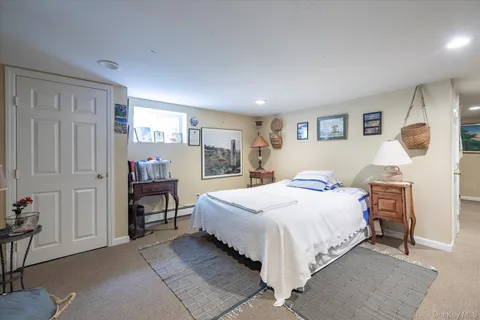 a bedroom with a bed and a table