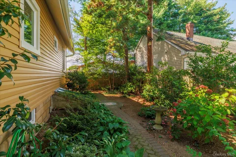 a backyard of a house with lots of green space