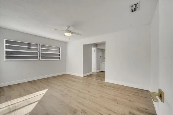 a view of an empty room with a window