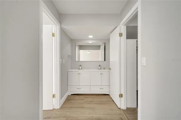 a bathroom with a sink and a mirror