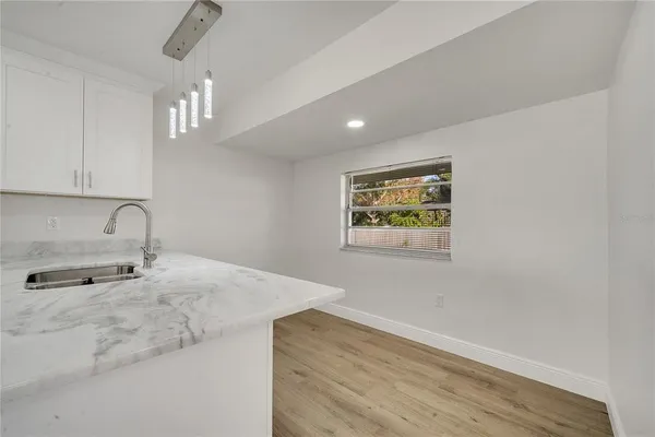 a view of a kitchen with a sink and dishwasher