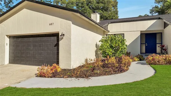 a front view of a house with garden