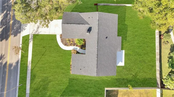 an aerial view of a house with a garden