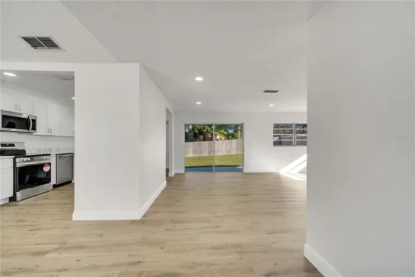 a view of kitchen with a sink and a stove top oven