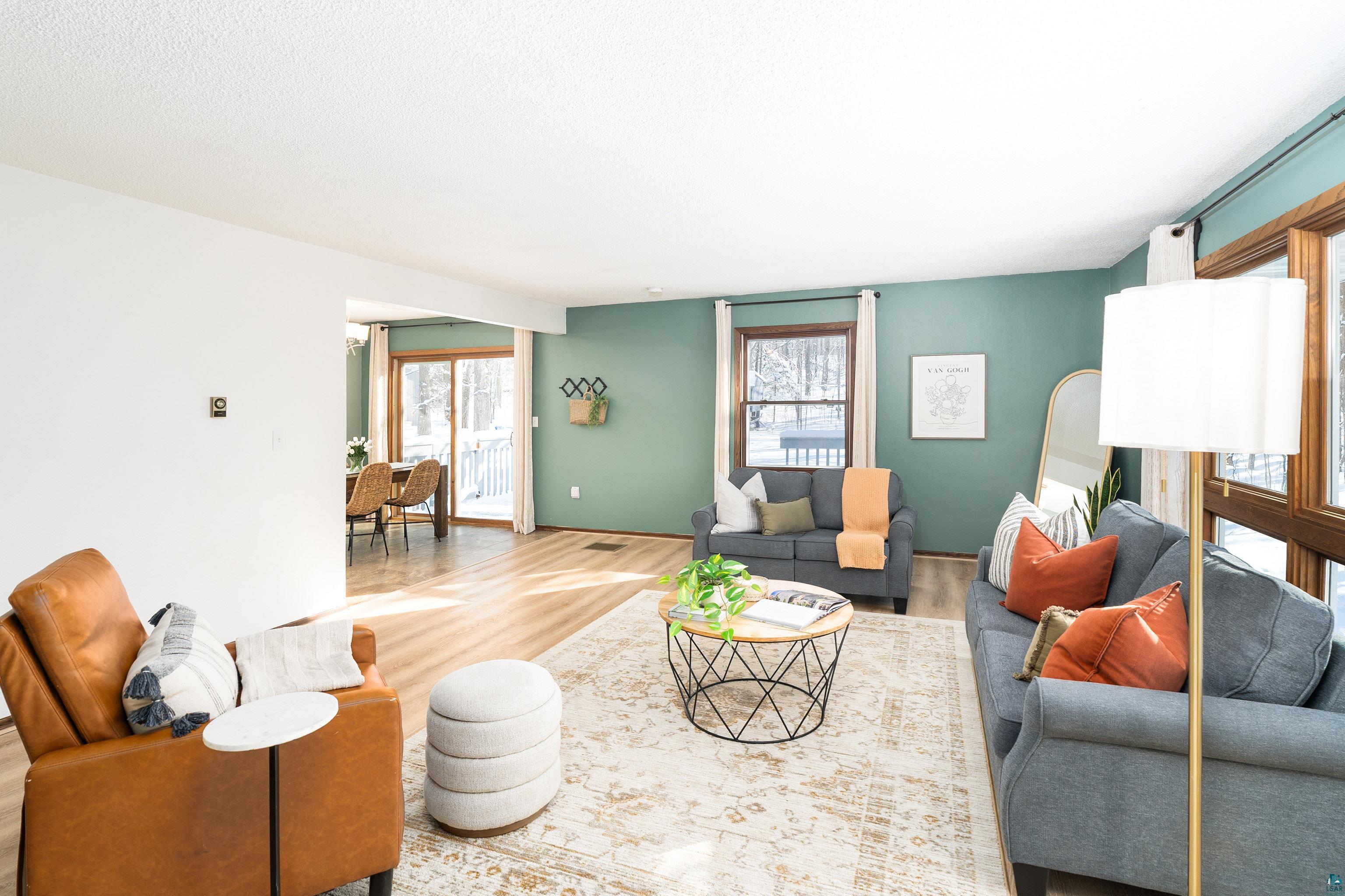 5947 East St Louis River Road Proctor, MN 55810 - Photo 15 of 47 Living room featuring healthy amount of natural light and wood finished floors