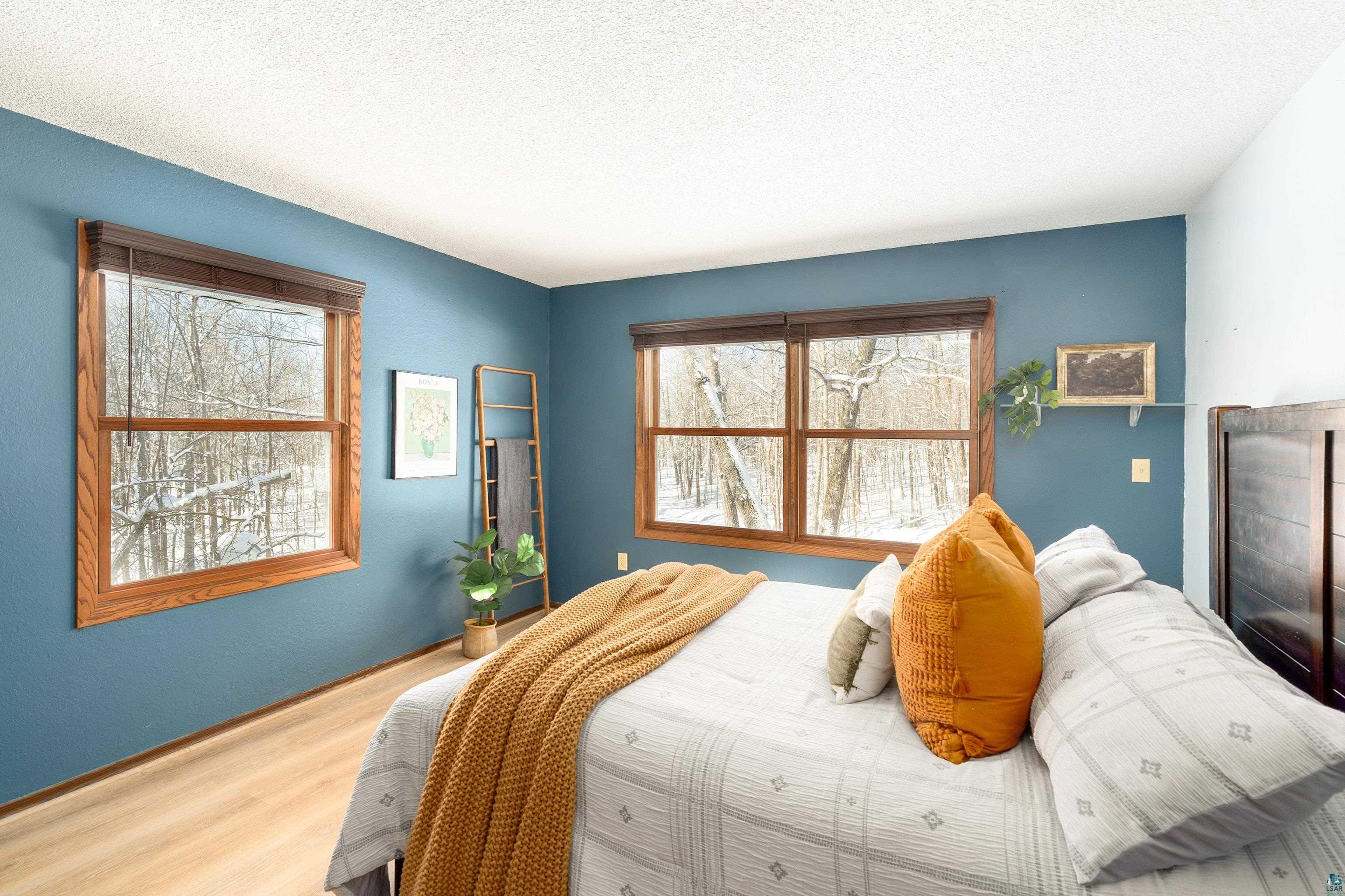 5947 East St Louis River Road Proctor, MN 55810 - Photo 18 of 47 Bedroom with wood finished floors and a textured ceiling