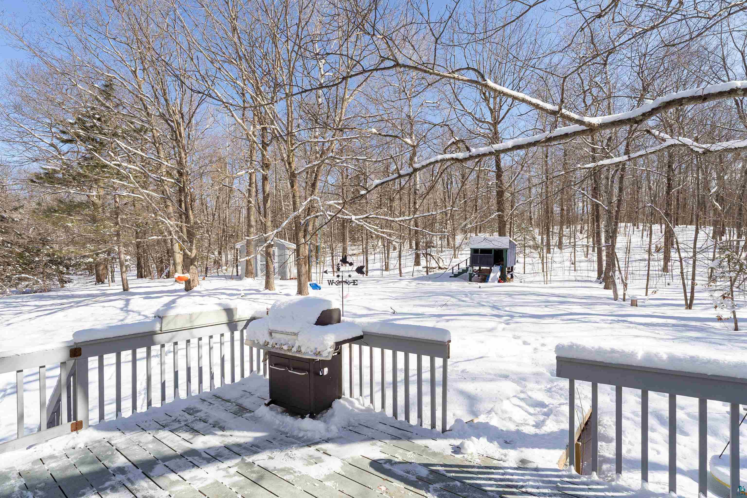 5947 East St Louis River Road Proctor, MN 55810 - Photo 33 of 47 Snow covered deck with a grill