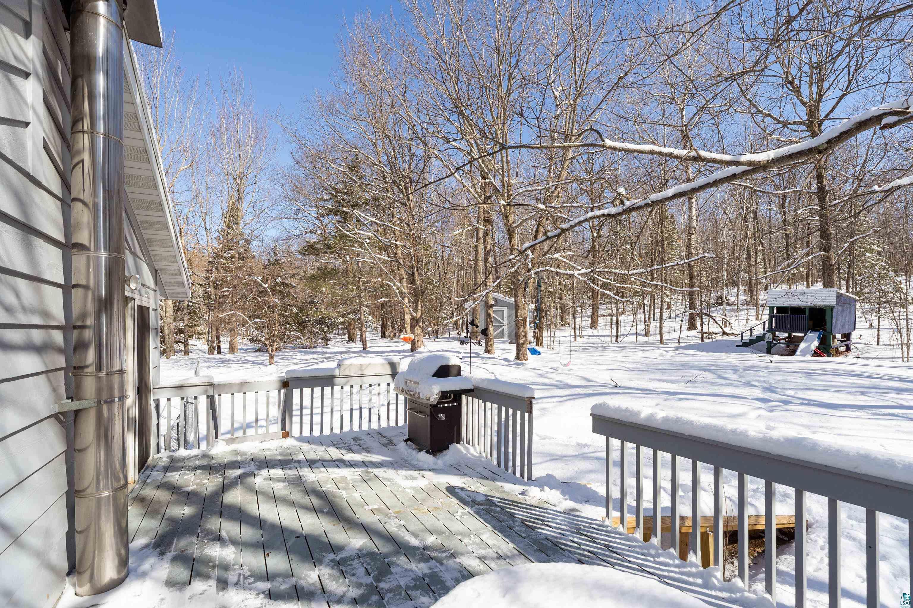 5947 East St Louis River Road Proctor, MN 55810 - Photo 34 of 47 Snow covered deck featuring grilling area