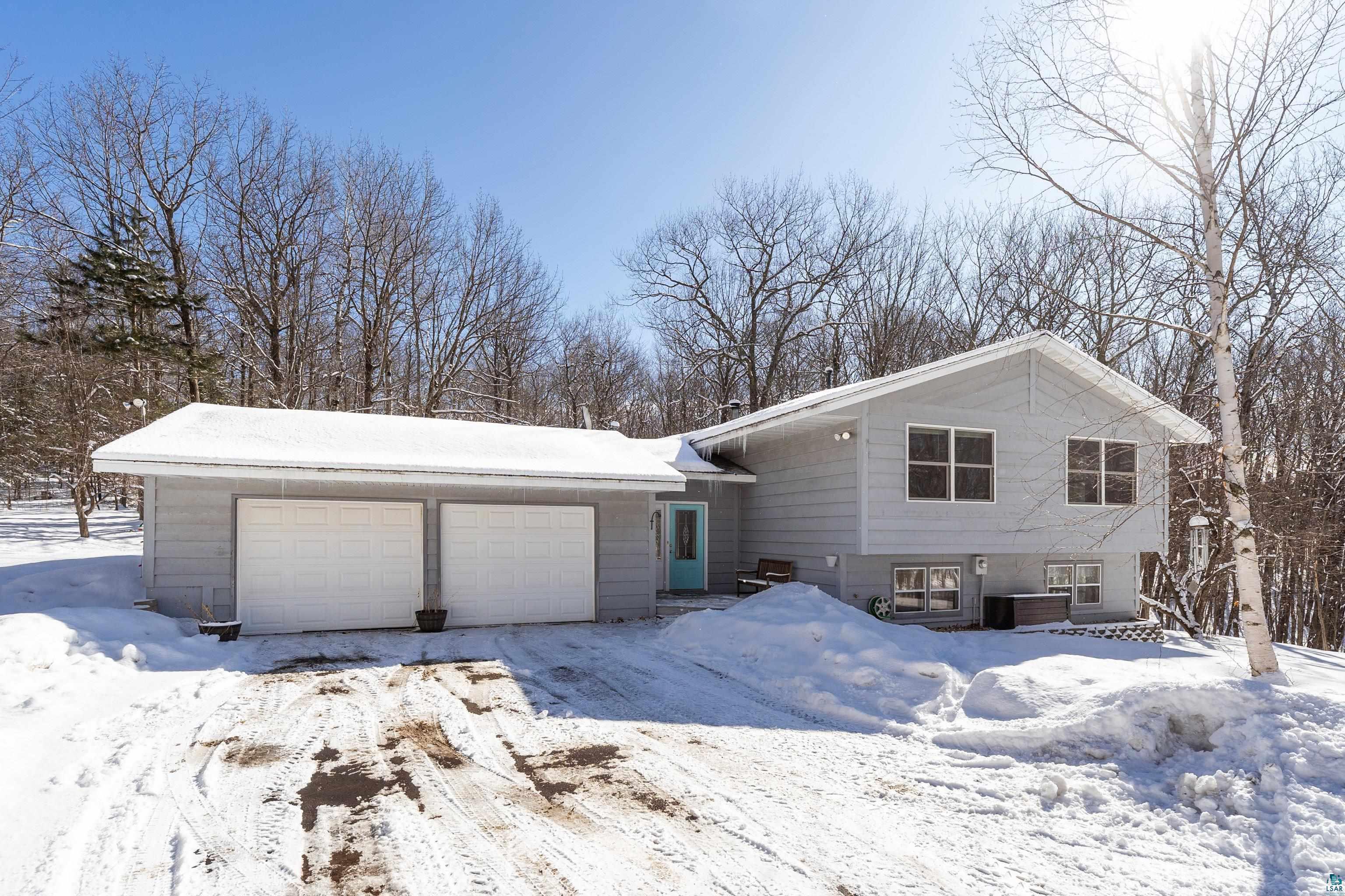 5947 East St Louis River Road Proctor, MN 55810 - Photo 38 of 47 View of front of house featuring a garage