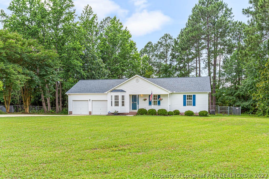 495 Sawyer Road Cameron, NC 28326 - Photo 1 of 33 a view of a house with a yard