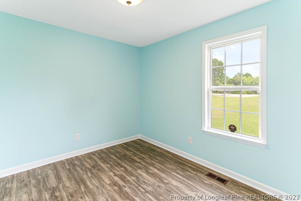 495 Sawyer Road Cameron, NC 28326 - Photo 18 of 33 an empty room with a window