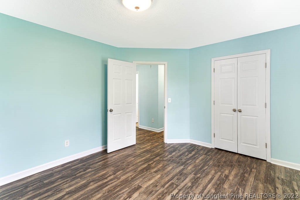 495 Sawyer Road Cameron, NC 28326 - Photo 20 of 33 a view of an empty room with wooden floor and closet