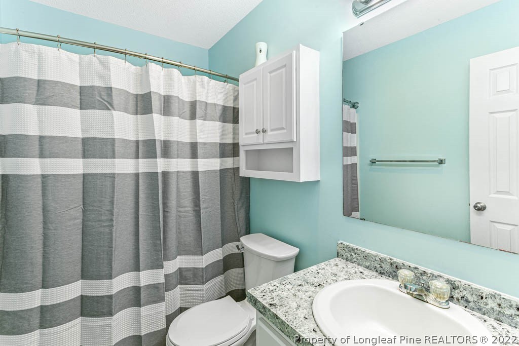 495 Sawyer Road Cameron, NC 28326 - Photo 21 of 33 a bathroom with a sink toilet and shower