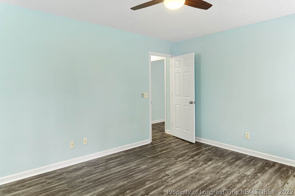 495 Sawyer Road Cameron, NC 28326 - Photo 23 of 33 a view of an empty room with wooden floor