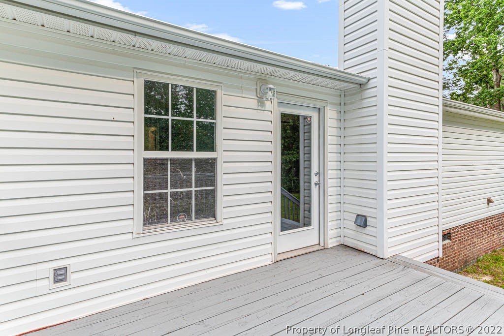 495 Sawyer Road Cameron, NC 28326 - Photo 27 of 33 a view of a house with wooden deck