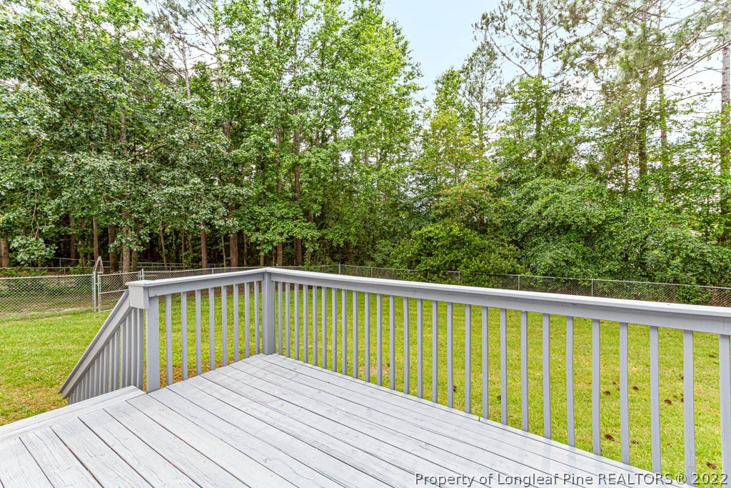 495 Sawyer Road Cameron, NC 28326 - Photo 30 of 33 a view of balcony with wooden floor and fence