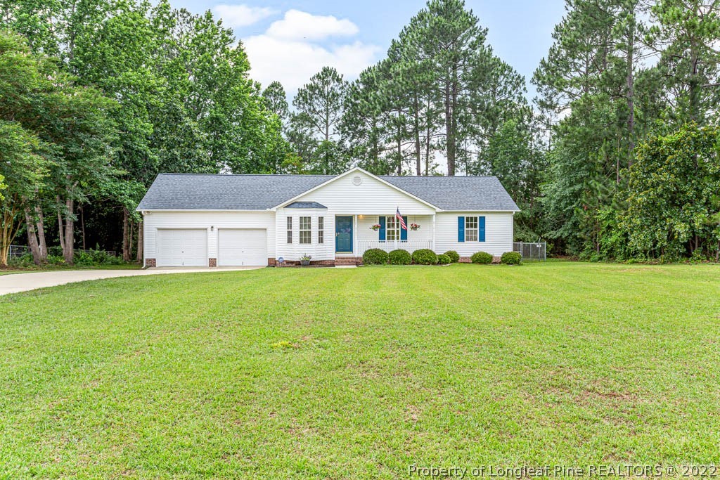 495 Sawyer Road Cameron, NC 28326 - Photo 3 of 33 a front view of a house with yard and green space