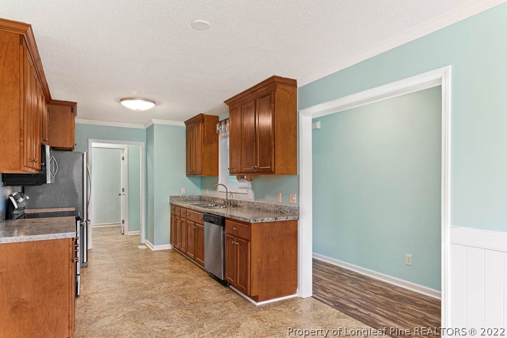 495 Sawyer Road Cameron, NC 28326 - Photo 6 of 33 a spacious bathroom with a granite countertop sink and a mirror