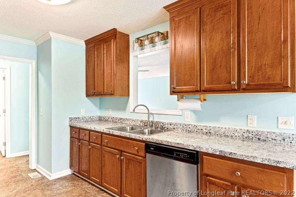 495 Sawyer Road Cameron, NC 28326 - Photo 8 of 33 a kitchen with granite countertop stainless steel appliances granite countertop a sink and cabinets