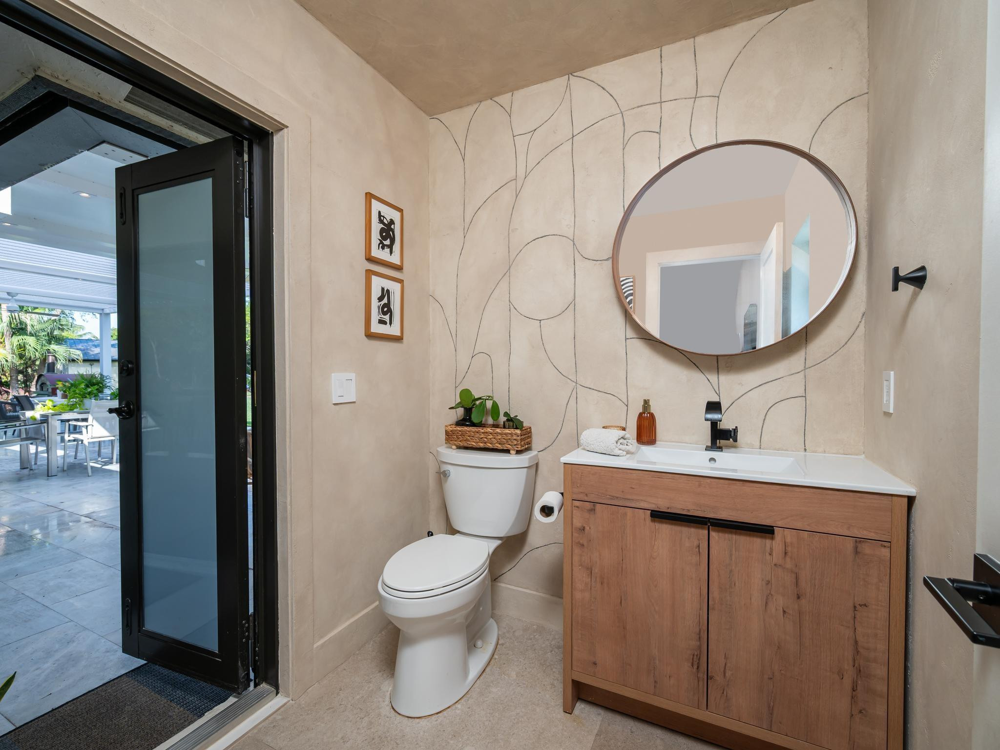 17451 Southwest 46th Street Southwest Ranches, FL 33331 - Photo 18 of 48 a bathroom with a toilet a sink and mirror