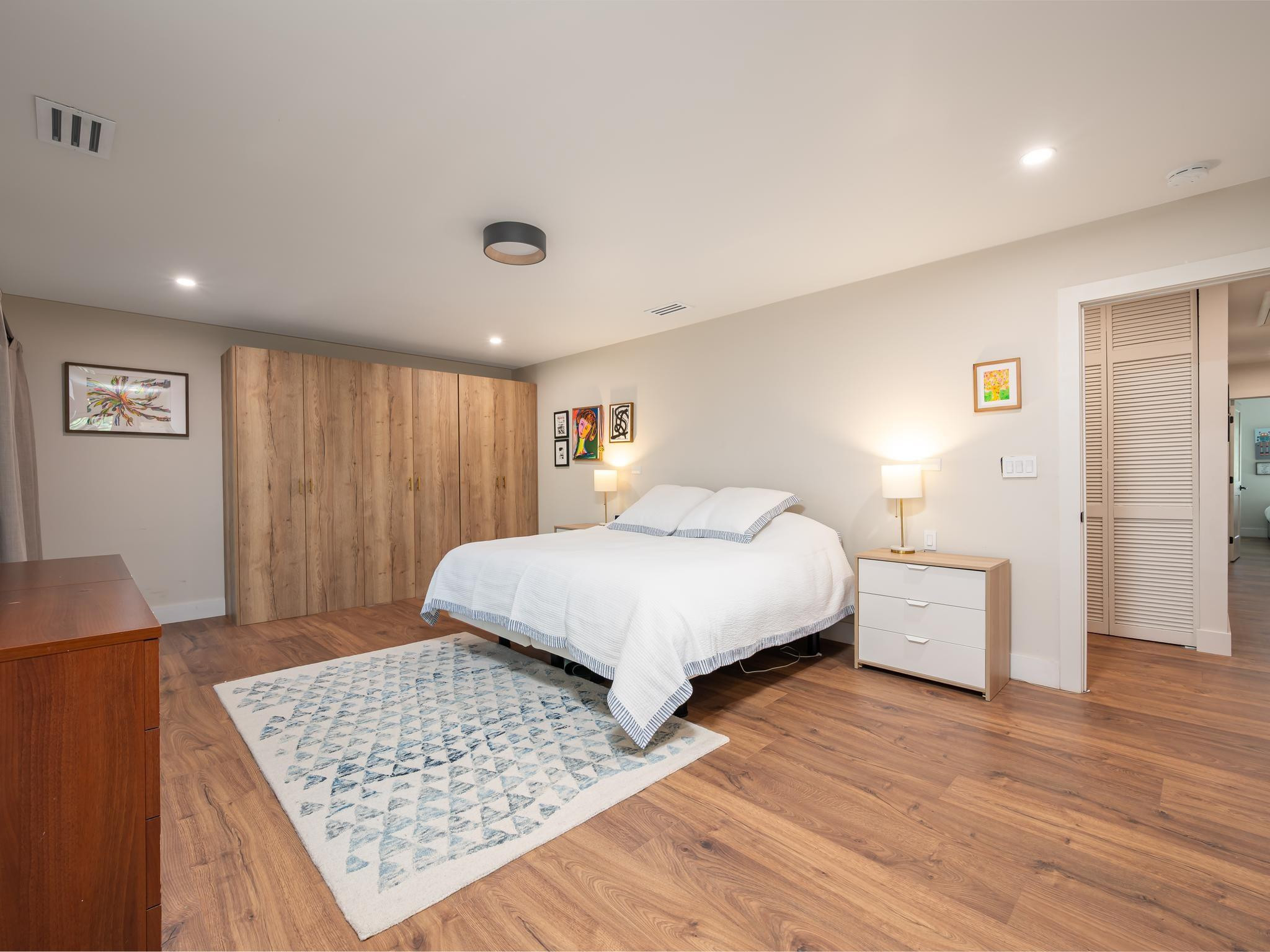 17451 Southwest 46th Street Southwest Ranches, FL 33331 - Photo 19 of 48 a bedroom with a bed and wooden floor