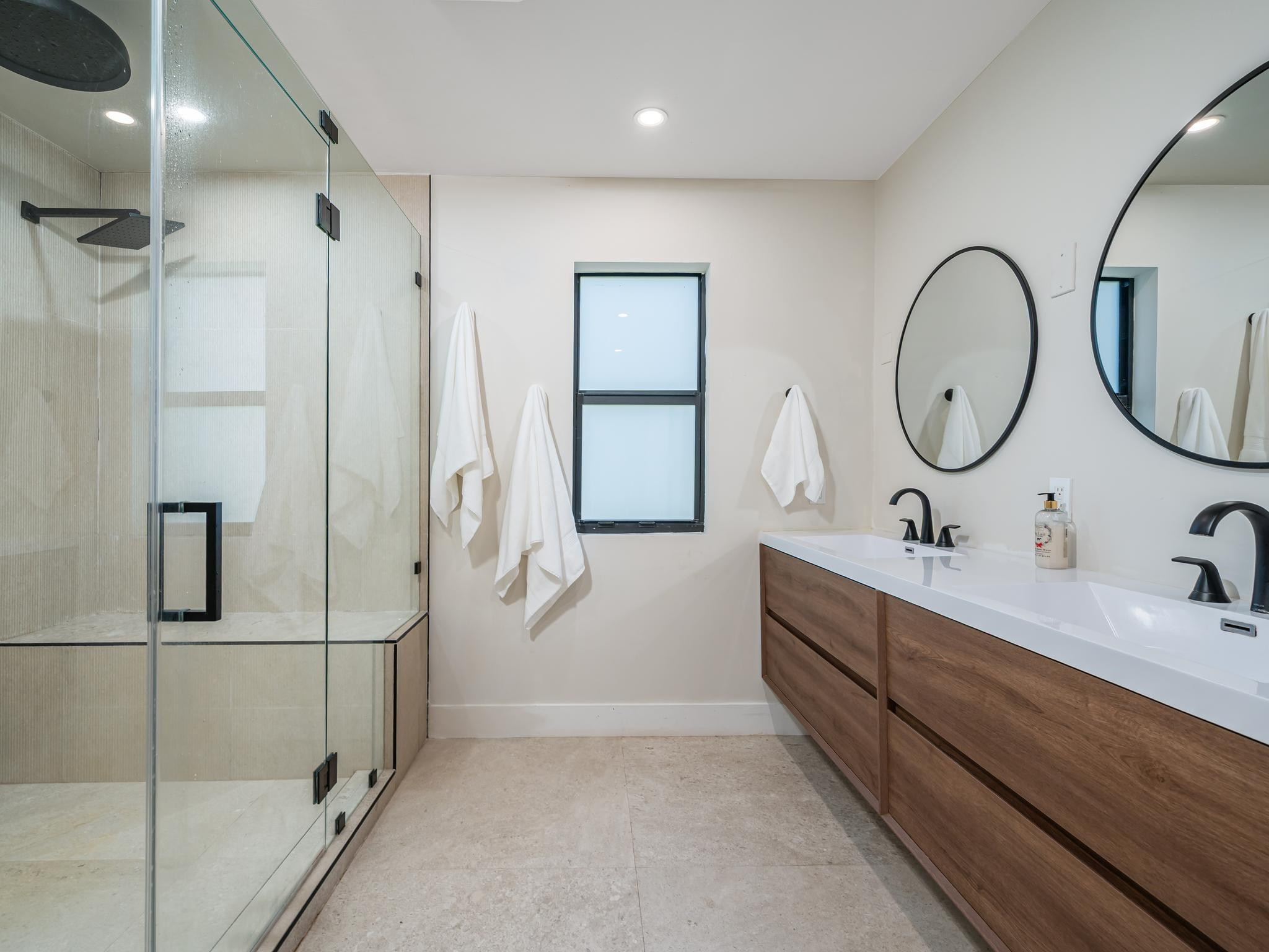 17451 Southwest 46th Street Southwest Ranches, FL 33331 - Photo 22 of 48 a bathroom with a double vanity sink mirror and shower