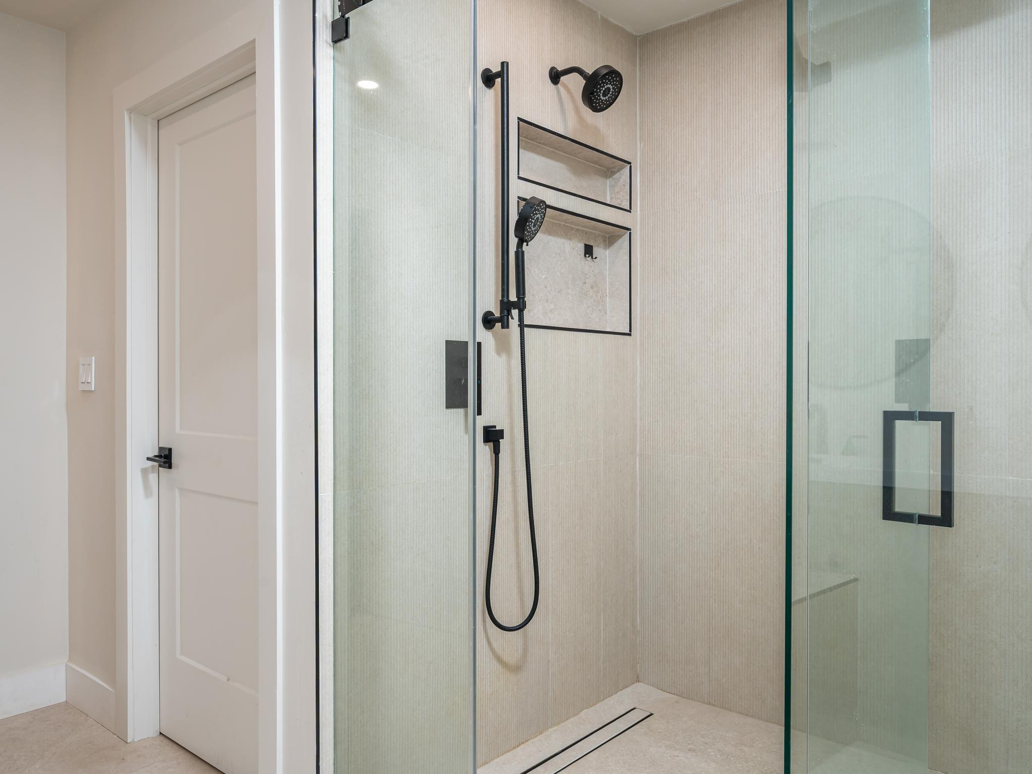 17451 Southwest 46th Street Southwest Ranches, FL 33331 - Photo 23 of 48 a bathroom with a glass shower door