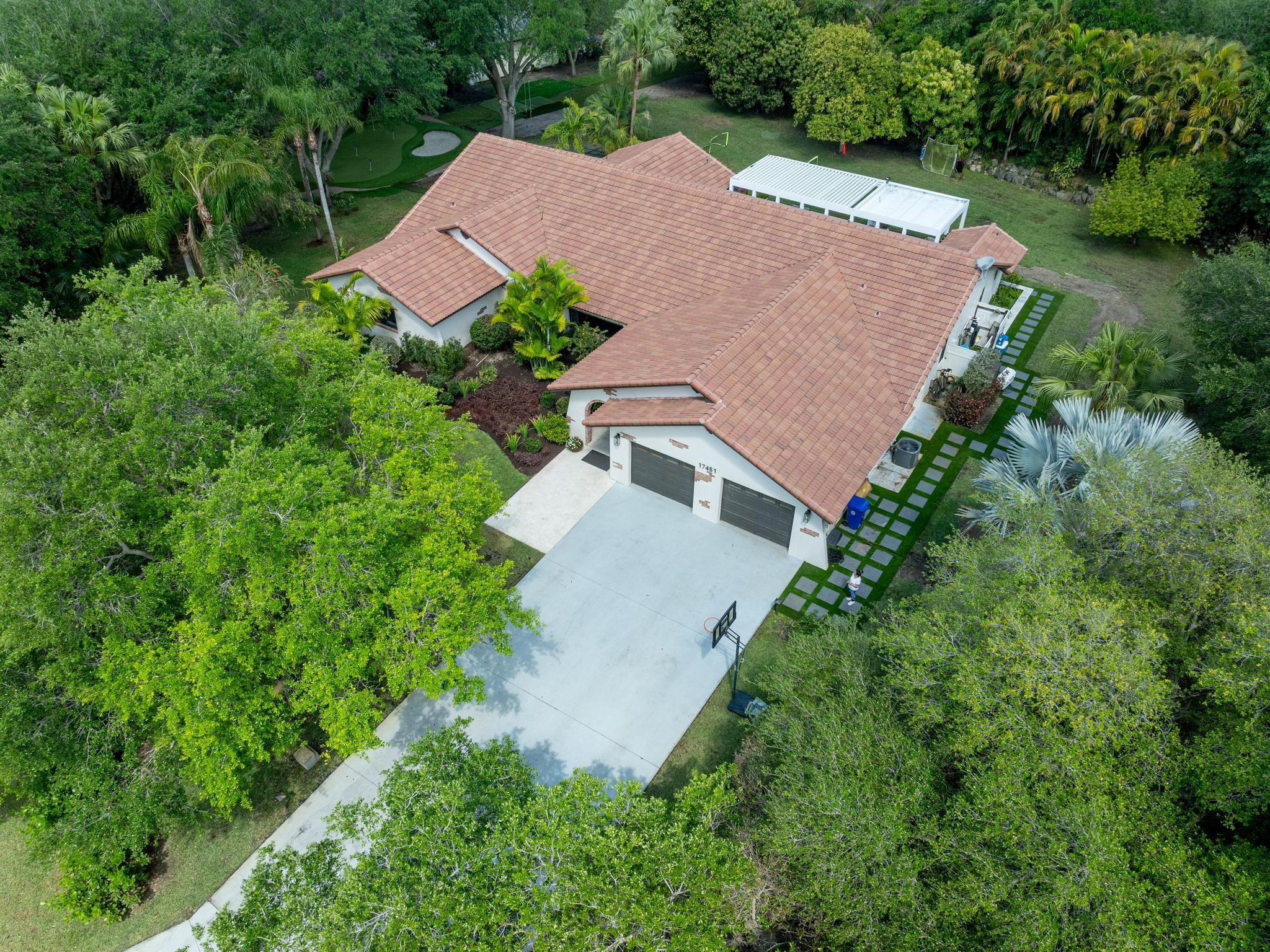 17451 Southwest 46th Street Southwest Ranches, FL 33331 - Photo 37 of 48 an aerial view of a house and trees all around