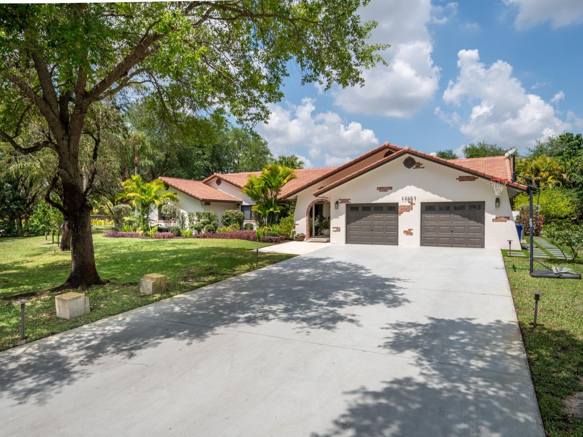 17451 Southwest 46th Street Southwest Ranches, FL 33331 - Photo 38 of 48 a view of house with a yard