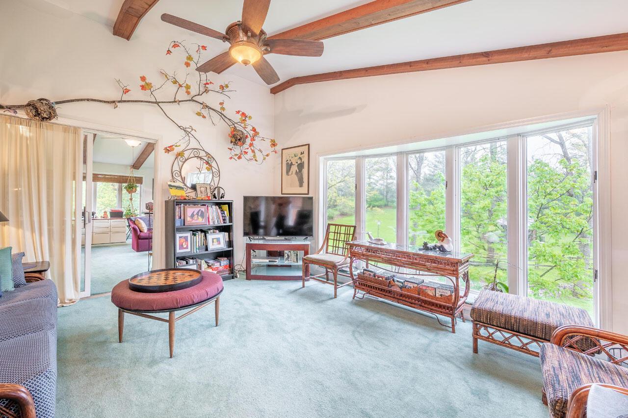 1640 Carriage Road Powell, OH 43065 - Photo 17 of 63 The tv room also has a bow window overlooking the woods, stream, and back yard.