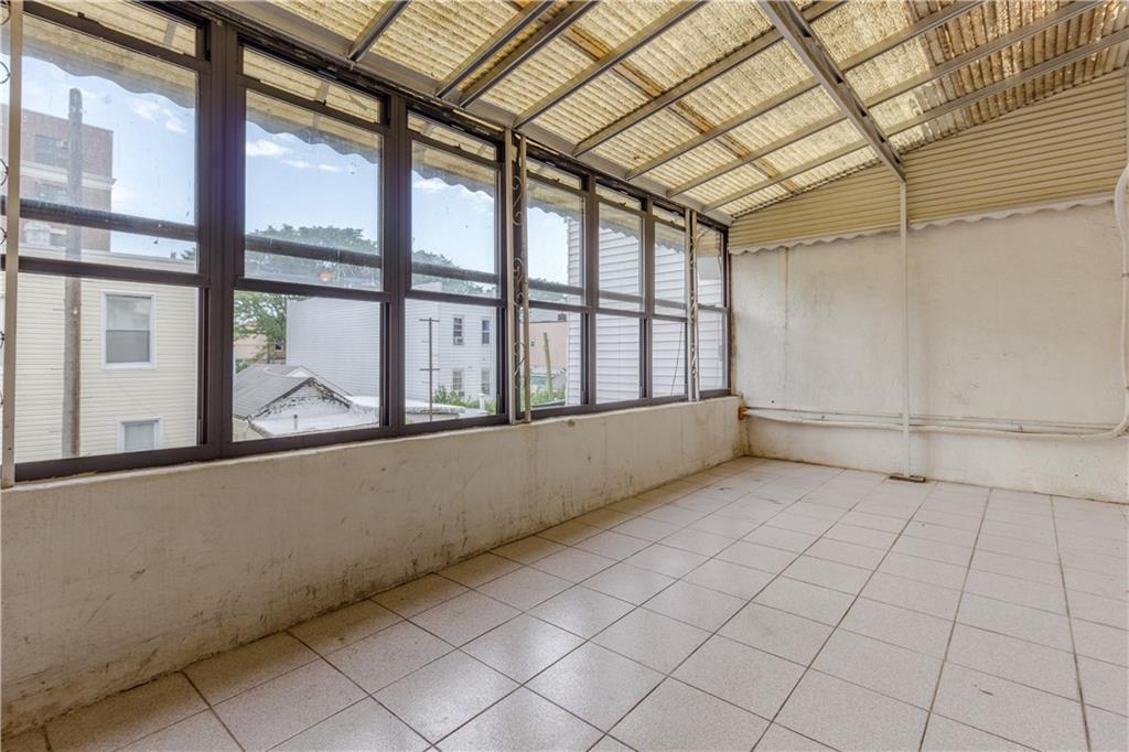 119 28th Avenue Brooklyn, NY 11214 - Photo 4 of 7 a view of an empty room with a window