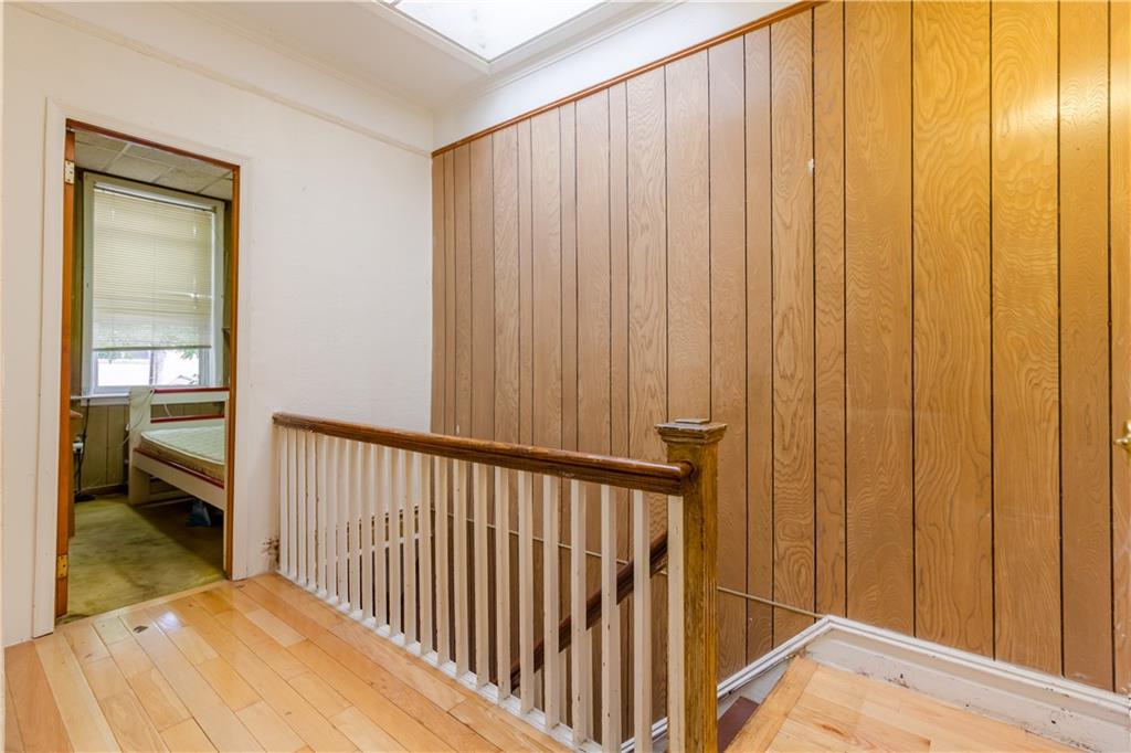 119 28th Avenue Brooklyn, NY 11214 - Photo 5 of 7 a view of a porch with wooden floor