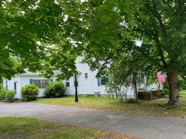 a house with trees in the background